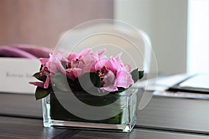Pink flowers on a meeting room table
