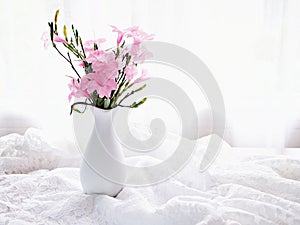 Pink flowers in vase on table Ruellia tuberosa