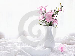 Pink flowers in vase on table Ruellia tuberosa