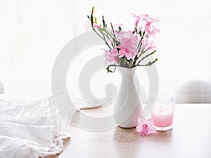 Pink flowers in vase on table Ruellia tuberosa