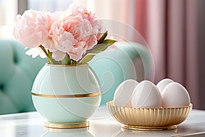 Pink flowers and white Easter eggs on table. Art deco style interior