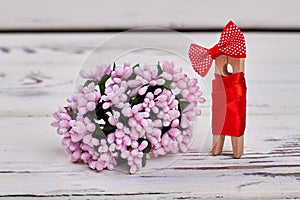 Pink flowers and wooden pin