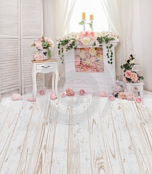 Pink and fraise flowers in fireplace with cute shabby chic furniture