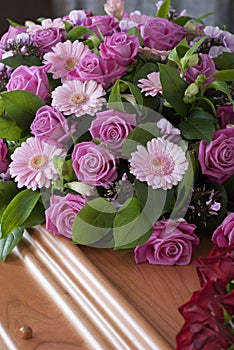 Pink Funeral flowers on a casket