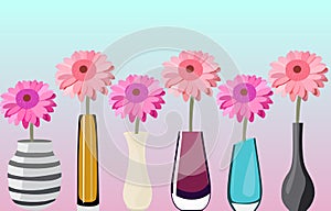 Pink gerberas in colorful vases