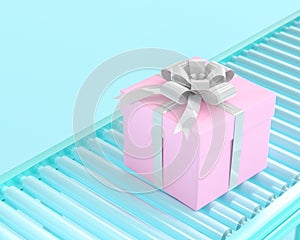 Pink gift box on conveyor roller