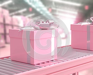 Pink gift box on conveyor roller