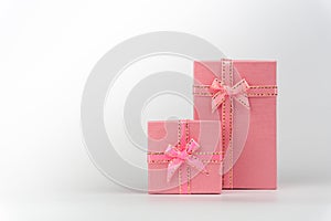 Pink Gift Box with satin bow ribbon on white background, Valentine`s Day Gift, Happy Women`s Day, Mother`s Day, Birthday, Wedding,