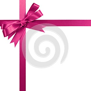 Pink gift ribbon bow vertical corner border frame isolated on white