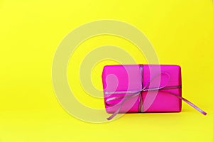 Pink gift in the yellow background for celebration  Valentines  day