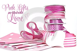 Pink Gifts are filled with Love, greeting with polka dot and plain ribbons, scissors, and wrapping paper