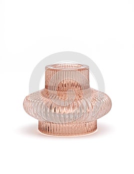 Pink glass candlesticks holder with a corrugated surface isolated on white