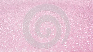 Pink glitter for an abstract background, selective focus