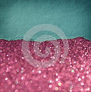 Pink glitter background and blue vintage torn paper . room for copy space.