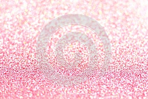 Pink glitter background with selective focus