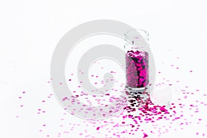 Pink Glitters makeup in transparent bottle isolated on white background