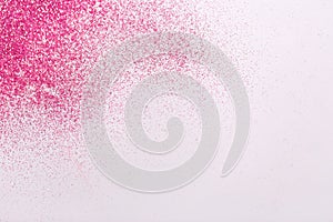 Pink glitters on white background