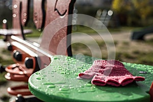 Pink glove on see-saw seat.