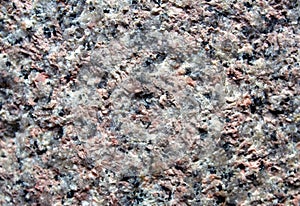 Pink granite rock surface texture