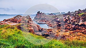The pink granite rocks with strange shapes, coast in Brittany. T