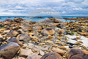 The pink granite rocks with strange shapes, coast in Brittany. T