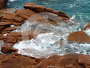 Pink granite and turquoise water