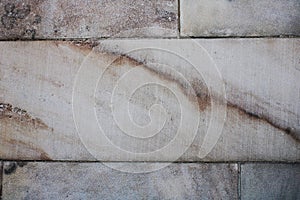 Striations through blocks of white and gray marble photo