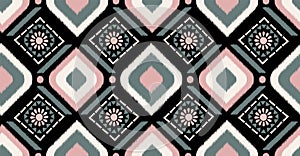 Pink green orange geometric seamless pattern with flower on black background in African style. Vector illustration use for ikat