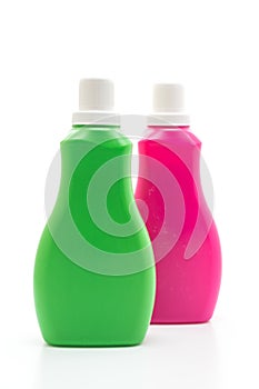 pink and green plastic bottle for detergent or floor liquid cleaning on white background