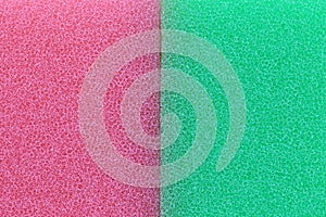 Pink and green sponge surface background.