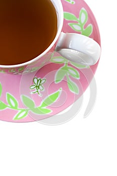 Pink and green tea cup and saucer