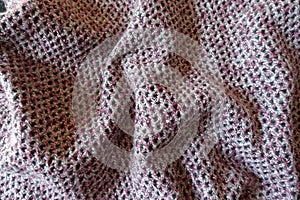Pink, grey and white fabric with diamonds pattern in soft folds