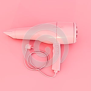 pink hair dryer isolated on pink background