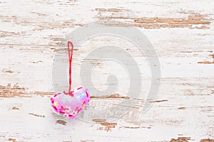 Pink heart on a vintage retro wooden background