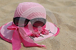 Pink hat with black shades on the sand - beach vacation - Paradise Beach - Pondicherry tourism - India holiday destination