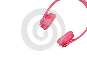 Pink headphones for listening to sound and music on a white background