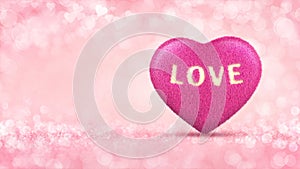 Pink heart as furry cushion concept on glamour bright bokeh background.