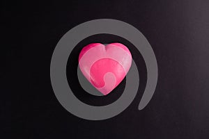 Pink heart on a black background