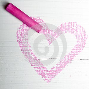 Pink heart and chalk