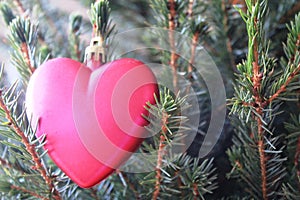 Pink heart on the Christmas tree