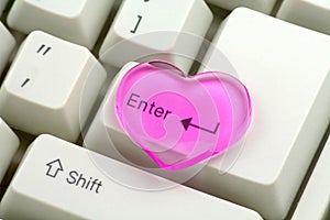 Pink heart and enter key, love concept