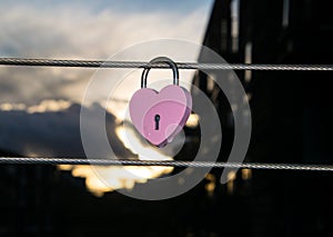 Pink heart shaped padlock hanging