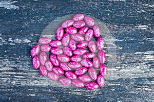 Pink heart on wooden background