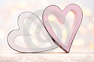 Pink hearts on the bokeh background. Valentine Day background.