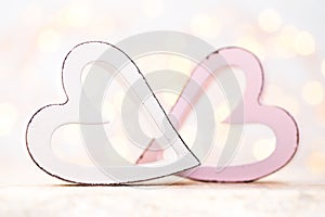 Pink hearts on the bokeh background. Valentine Day background.