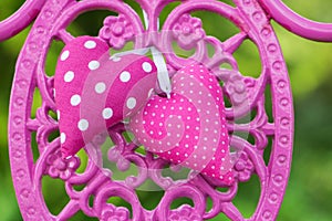 Pink hearts on a garden chair