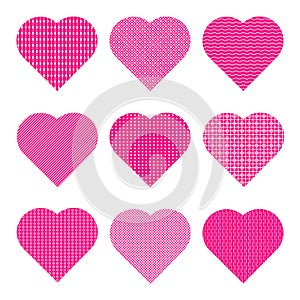 Pink hearts with various white geometric patterns. Set of 9 vector icons isolated.