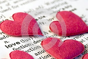 Pink hearts on word love
