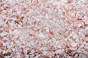 Pink Himalayan salt background top view.