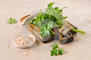 Pink Himalayan salt and a bunch of fresh parsley with a tag